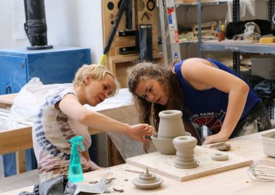 Ceramics faculty Gerit Grimm reviews a project with a student at the Art Lofts Ceramics lab.