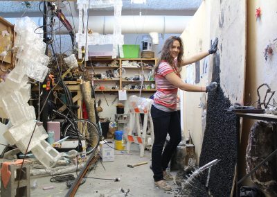 Graduate art student Sarah Deppe works on a piece in her studio space in the Art Lofts building at the University of Wisconsin-Madison.