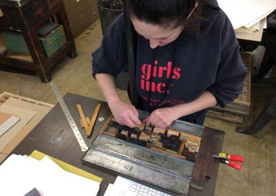 A student places movable type in a bed for a letterpress project during the Book Arts class taught by Jim Escalante at the Mosse Humanities Building at the University of Wisconsin-Madison.
