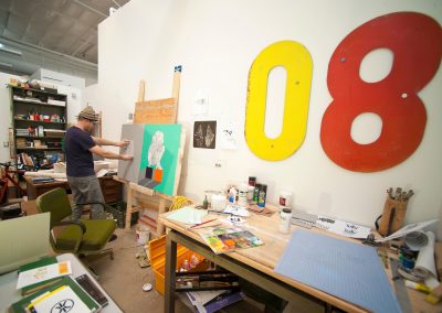 Graduate art student Eric Wold works on a painting in his studio in the Art Lofts building at the University of Wisconsin-Madison.