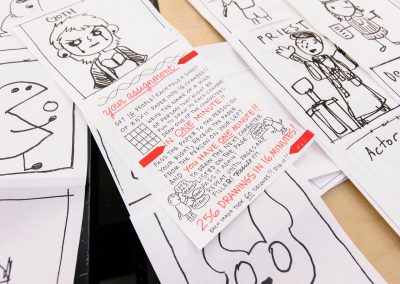 Assignment instructions for a student group exercise and some of the resulting character drawings are pictured during a Making Comics class taught by Lynda Barry at the Mosse Humanities Building at the University of Wisconsin-Madison.