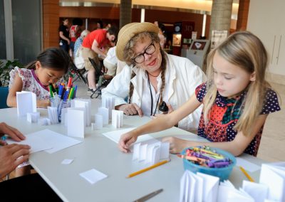Lynda Barry leads a "drawing jam" with children during a Saturday Science outreach event at the University of Wisconsin-Madison.