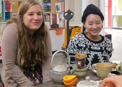 Students enjoy a tea party using handcrafted tea sets created in ceramics class at the Art Lofts Building at the University of Wisconsin-Madison.