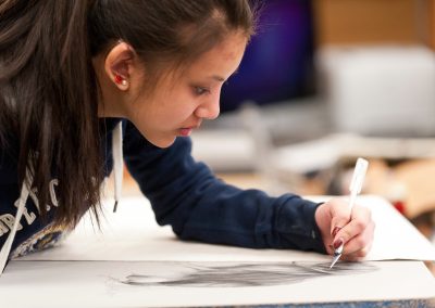 A student touches up their drawing on a lithography print at the Mosse Humanities Building at the University of Wisconsin-Madison.
