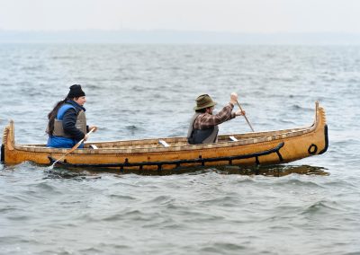 From back to front of canoe, Wayne Valliere, a Native American artist-in-residence with the Department of Art and member of the Lac du Flambeau Band of Lake Superior Chippewa Indians, and Tim Frandy, an outreach specialist at the UW Collaborative Center for Health Equity, take a traditional Ojibwe birchbark canoe for an inaugural paddle in Lake Mendota near the University of Wisconsin-Madison. The canoe is known in Ojibwe language as wiigwaasi-jiimaan, and was handmade by Valliere as part of his residency.