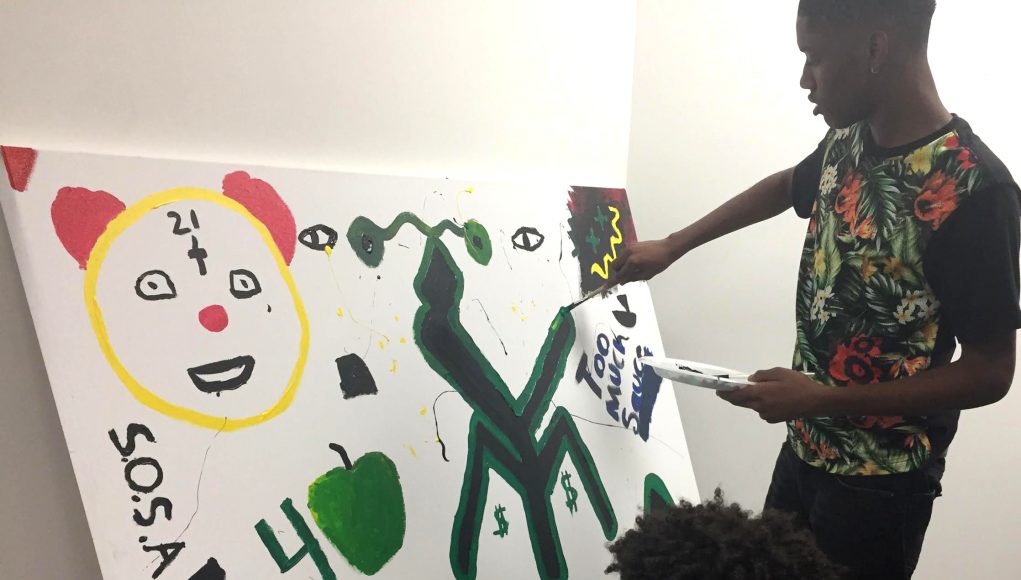 A teenager creates art at Making Justice, art program funded by the Madison Public Library.