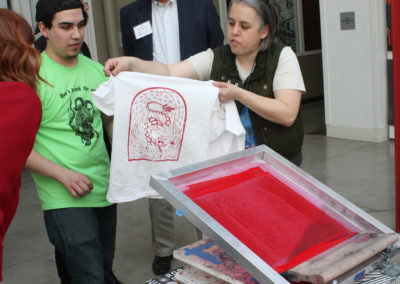 Fresh Hot Press Students pull a shirt printed with a design on the mobile serigraphy press at the Art Lofts building at the University of Wisconsin-Madison.