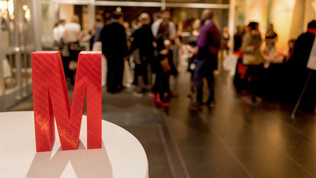 The physical M List award is different every year. In 2017 at the awards reception held at the Madison Museum of Contemporary Art, M List recipients were given a 3D printed "M" created by independent 3D artist, Steven Knurr.