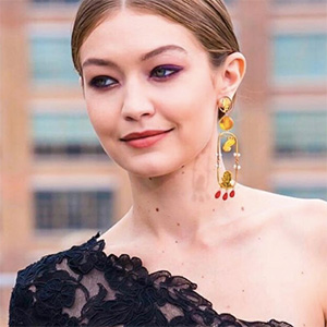 Photo of the designer earring worn by Gigi Hadid, by Stacey Lee Webber [MFA '08].