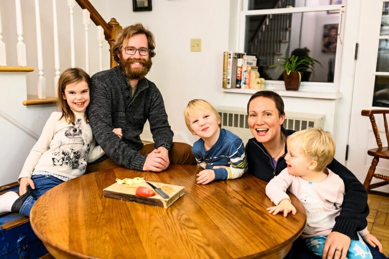 Parents Noah and Noël Ash, both UW–Madison students, are pictured with their children—Elsa, 7, Orion, 5, and Winifred, 3—at their home in University Apartments at UW–Madison. Noah is graduating Dec. 16 with a bachelor’s degree in philosophy and classical humanities. Noël is in her second year of a three-year masters of fine arts program in painting.