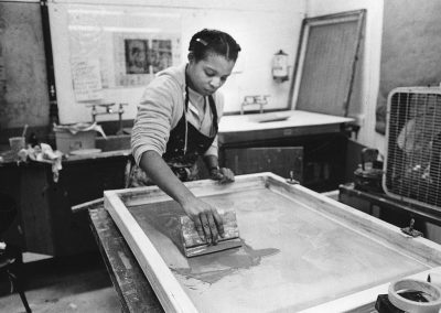 An art student works on a printmaking serigraphy project in the printmaking lab at the University of Wisconsin-Madison.