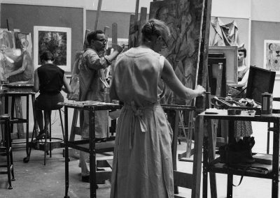 Art students create paintings in a studio in the 1950s.