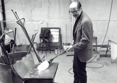 Professor of glass Harvey Littleton demonstrates glassblowing in the hot glass studio. During the 1963 academic year, Littleton introduced the first university program for glass in the United States at the University of Wisconsin-Madison.