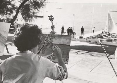 A student artist paints a view of Lake Mendota from the Memorial Union Terrace in 1963.