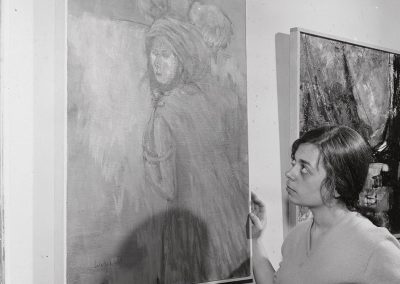 Sylvia Salachek stands by her artwork which made her the Capital Times winner in the 32nd annual Student Art Show, ca. 1960.