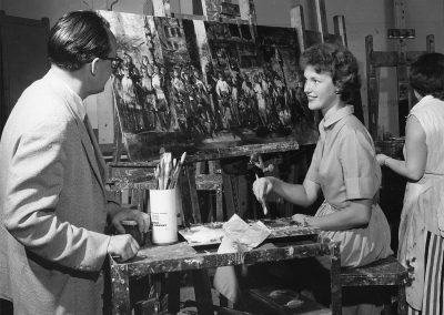 Art student Mary Kassner working on a painting, ca. 1958.