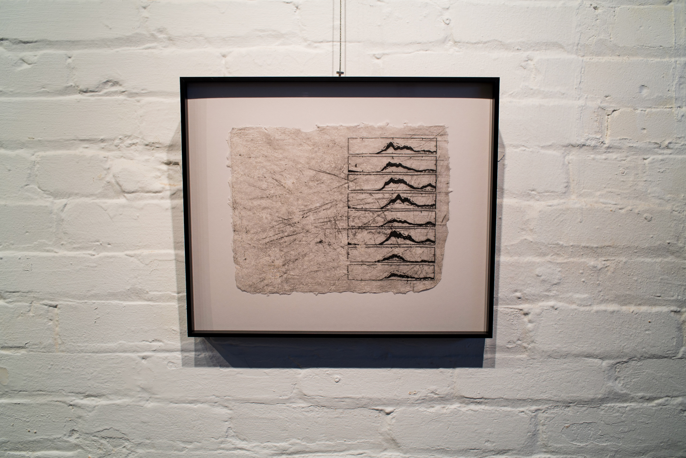 "Measurements of The Sea II" etching print on handmade paper with embedded California beach sand, from Adriana Barrios' Master of Fine Arts exhibition Long Range Signal at the Arts + Literature Laboratory. Photography by Kyle Herrera.
