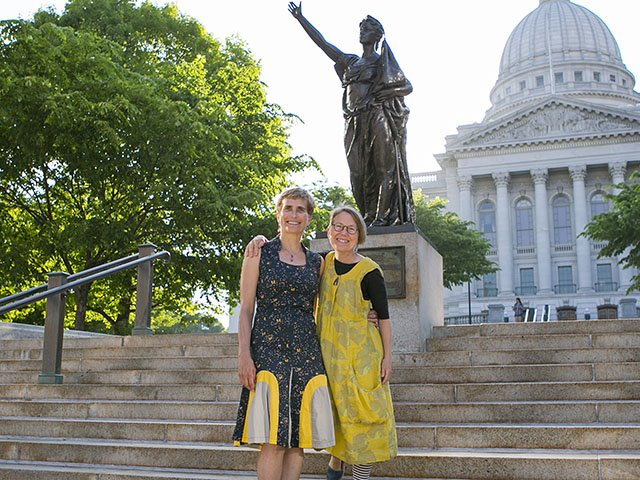 Brenda Baker, left, and Bird Ross near the replica of “Forward” at the state Capitol.