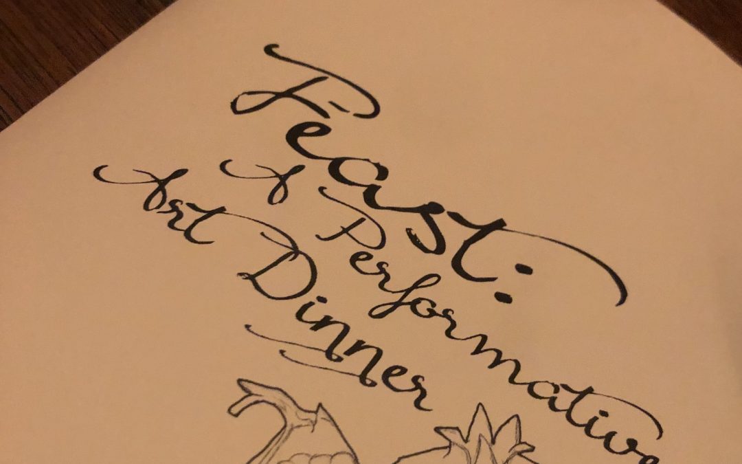 A closeup photo of the menu cover for Feast: A Performative Art Dinner