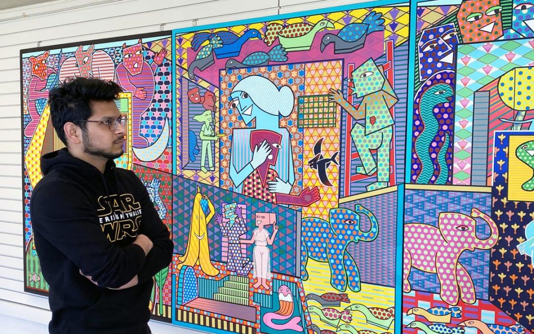 Madison artist and India native Pranav Sood observes his artwork during an opening reception for his exhibit Friday at Al. Ringling Theatre in Baraboo.