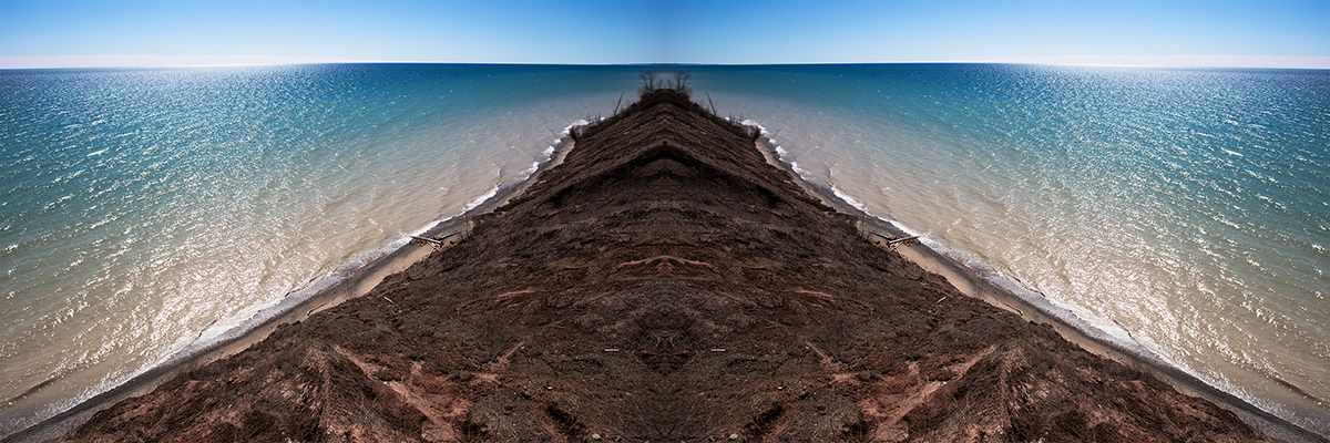 Lion Den, a mirrored photograph by Maxx McGinnis of Lion Den Gorge in Grafton, Wisconsin.