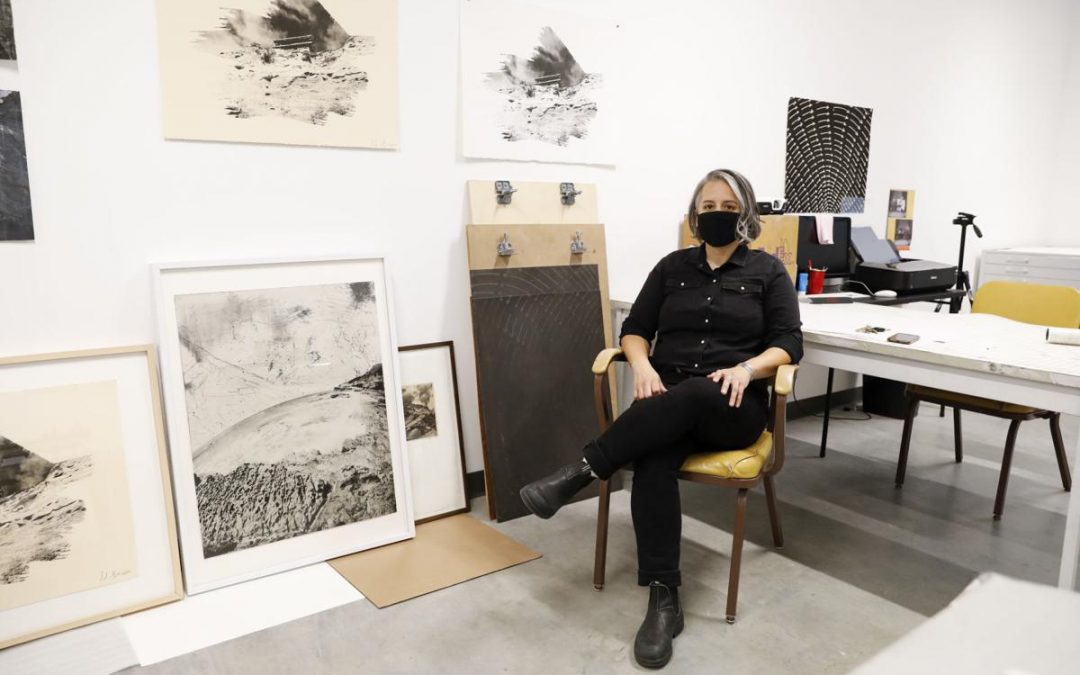 Artist Adriana Barrios poses for a portrait in her studio at the Arts + Literature Laboratory. Barrios was recently honored with the Forward Art Prize. Photo by Ruthie Hauge.