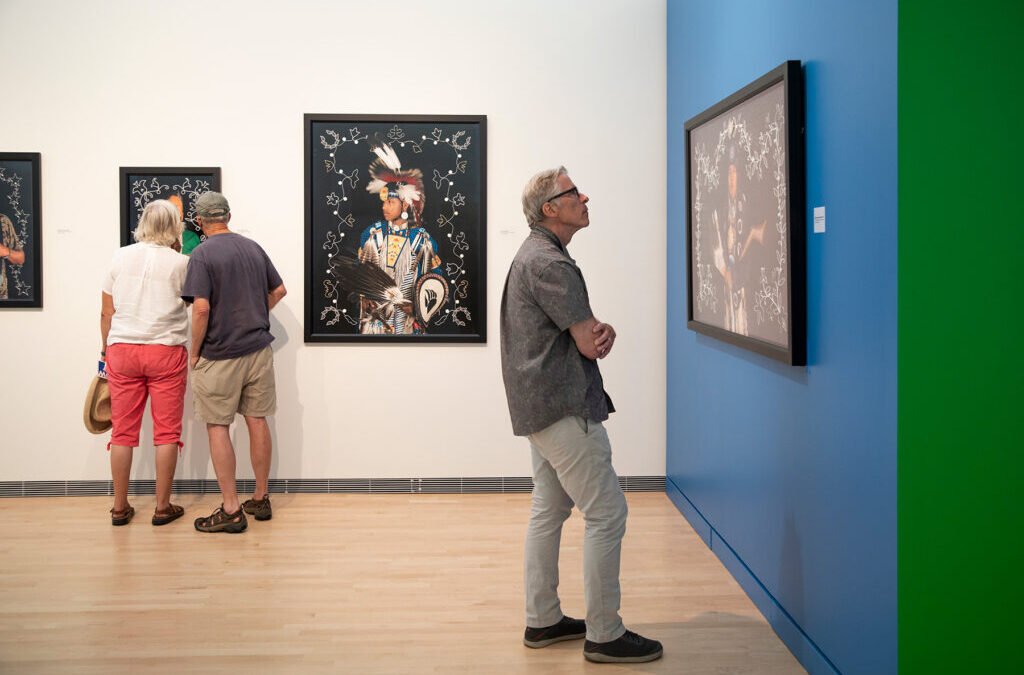 In his photo series “Strong Unrelenting Spirits,” Tom Jones incorporates beadwork directly through the photograph. The beadwork surrounding the person in the photo on display here “represents our ancestors and spirits that are watching over us,” Jones says. (Photo courtesy of the Museum of Wisconsin Art)