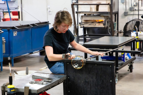 Amber Mans at work in the UW–Madison glass lab.