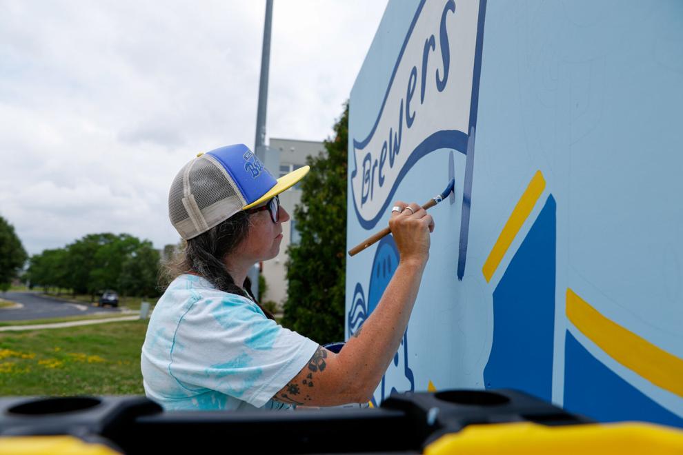 Balsley at work on her mural. Photo by Ashley Rodriguez, via Cap Times.