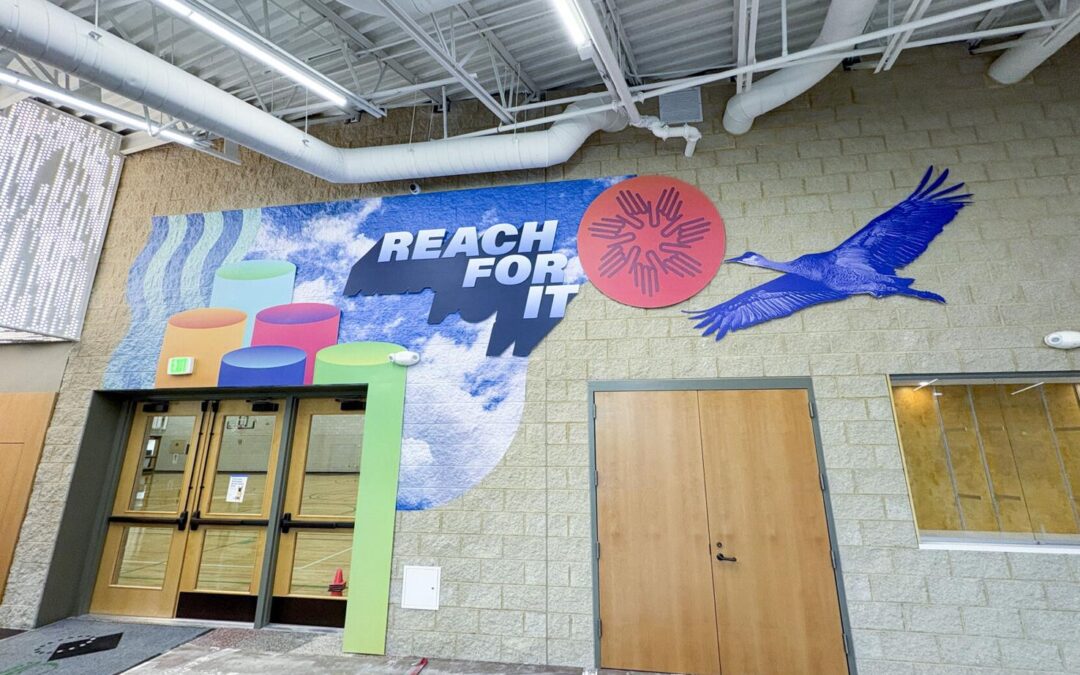 Photograph of the Reach For It mural courtesy of Adam Van Vreede via Cap Times.