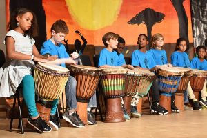 Students on stage performing during African night