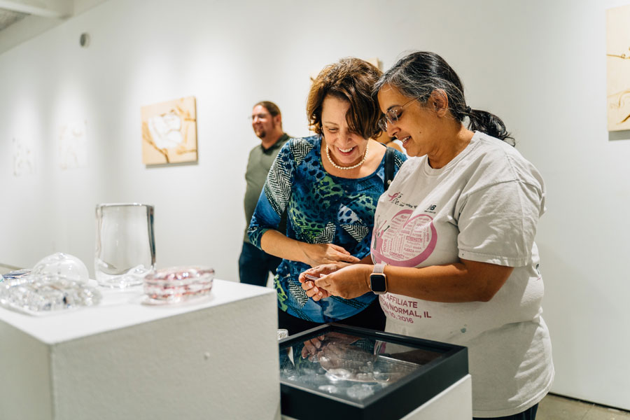 Summer Arts Studio participant shows Dean Hess her art work