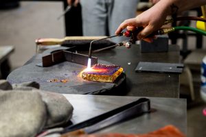 A flame being used on a glass project