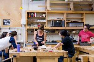 Sylvie Rosenthal teaching students in her wood working class during Summer Arts Studio