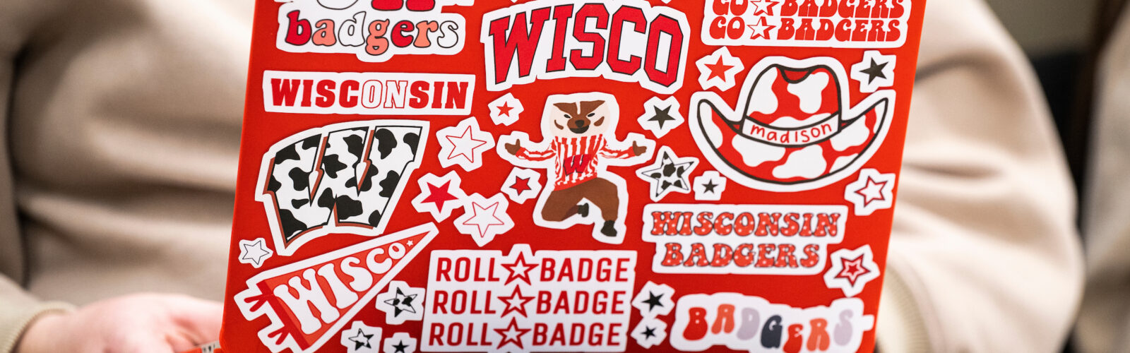 An undergraduate student takes notes on their laptop computer – which is thoroughly branded with Wisconsin Badgers-themed stickers – during a Curriculum and Instruction 372: Teaching Science class held in the Teacher Education Building at the University of Wisconsin–Madison on March 2, 2023. The class is taught by Diego Román, assistant professor of bilingual/bicultural education in the Department of Curriculum and Instruction in the School of Education. Román is one of twelve recipients of a 2023 Distinguished Teaching Award (DTA). (Photo by Jeff Miller / UW–Madison)