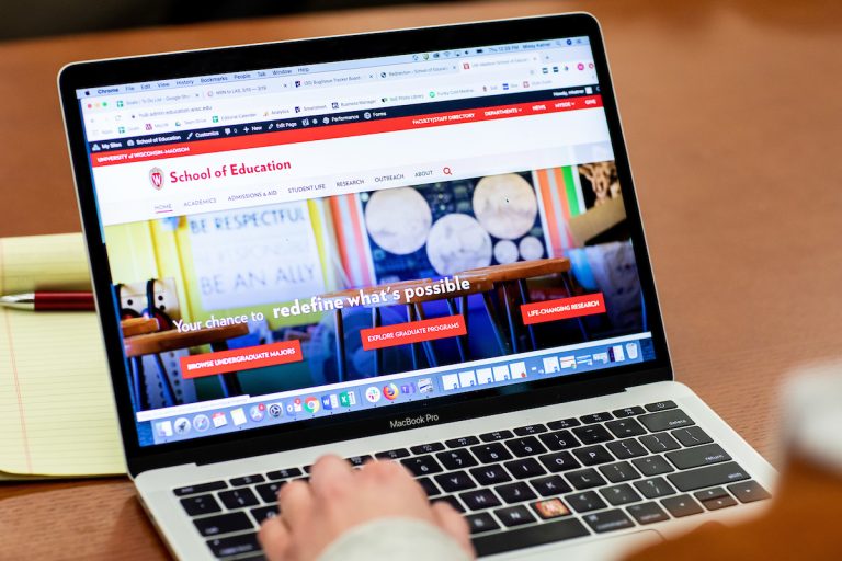 laptop computer with School of Education website displayed